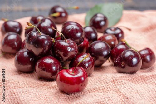 Giant fresh ripe black cherries, new harvest, ready to eat close up