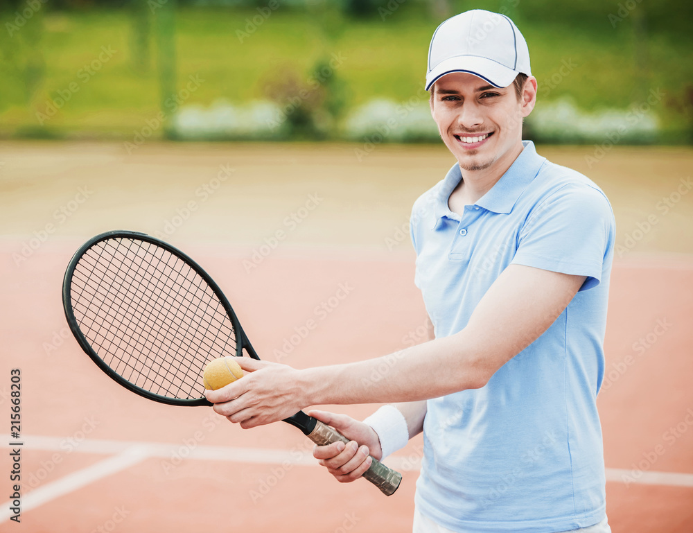 Young Guy in Shirt Ready to Serve on Tennis Court.