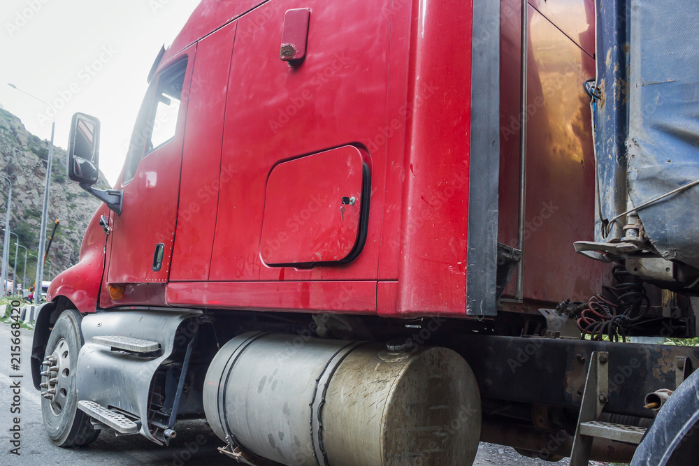 red cab of a large truck close-up red cab of a large truck close-up