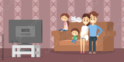 Family watching tv in the living room photo