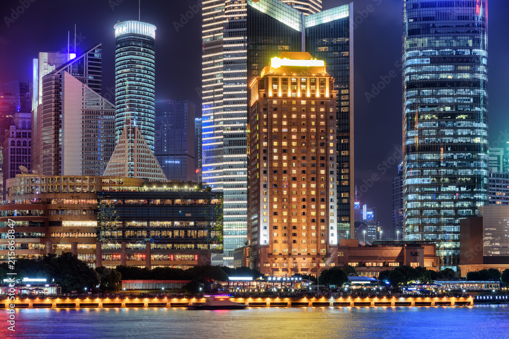 Colorful night view of glowing modern buildings, Shanghai, China