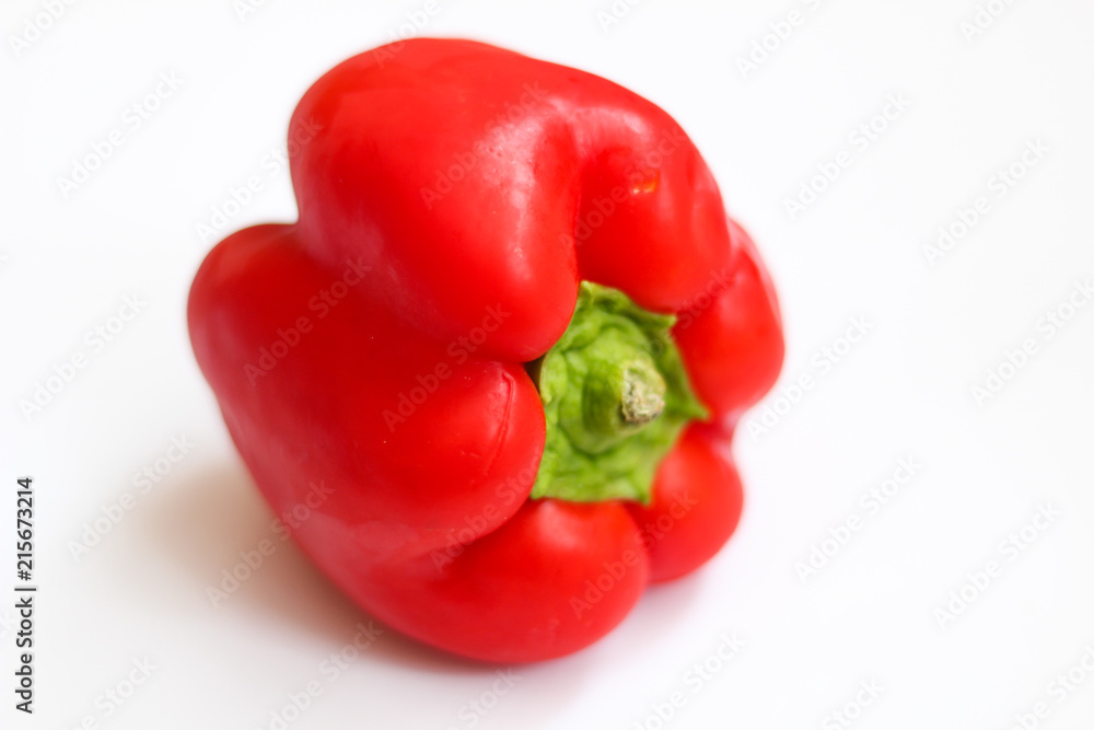 Red pepper, side view, selective focus, white background Red pepper, side view, selective focus, white background