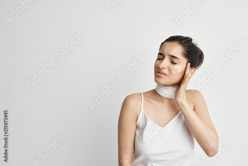 woman with a headache neck bandage