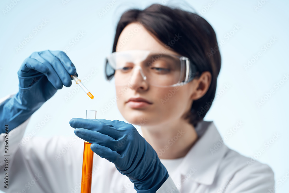 laboratory assistant test tube with a chemical liquid laboratory assistant test tube with a chemical liquid