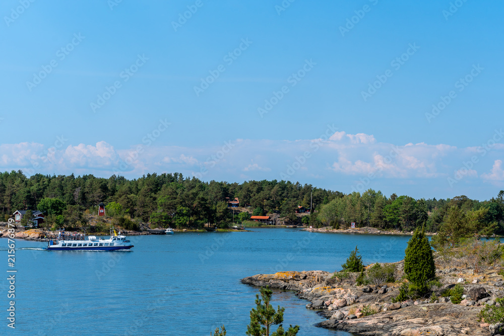 Tourists on a sightseeing trip in the wonderful archipelago of St. Anna in the Baltic Sea, Sweden.