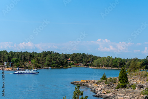 Tourists on a sightseeing trip in the wonderful archipelago of St. Anna in the Baltic Sea, Sweden.