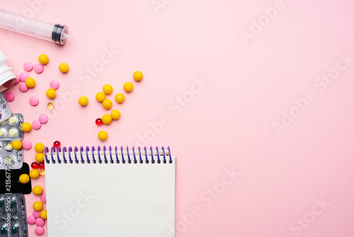 tablet notepad on pink background