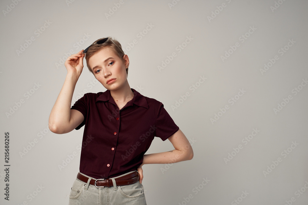 woman in shirt takes off glasses woman in shirt takes off glasses