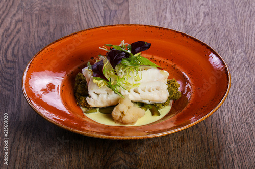 Steamed fith with salad photo