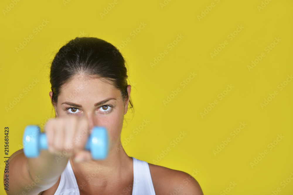 A beautiful young woman exercising - fitness concept