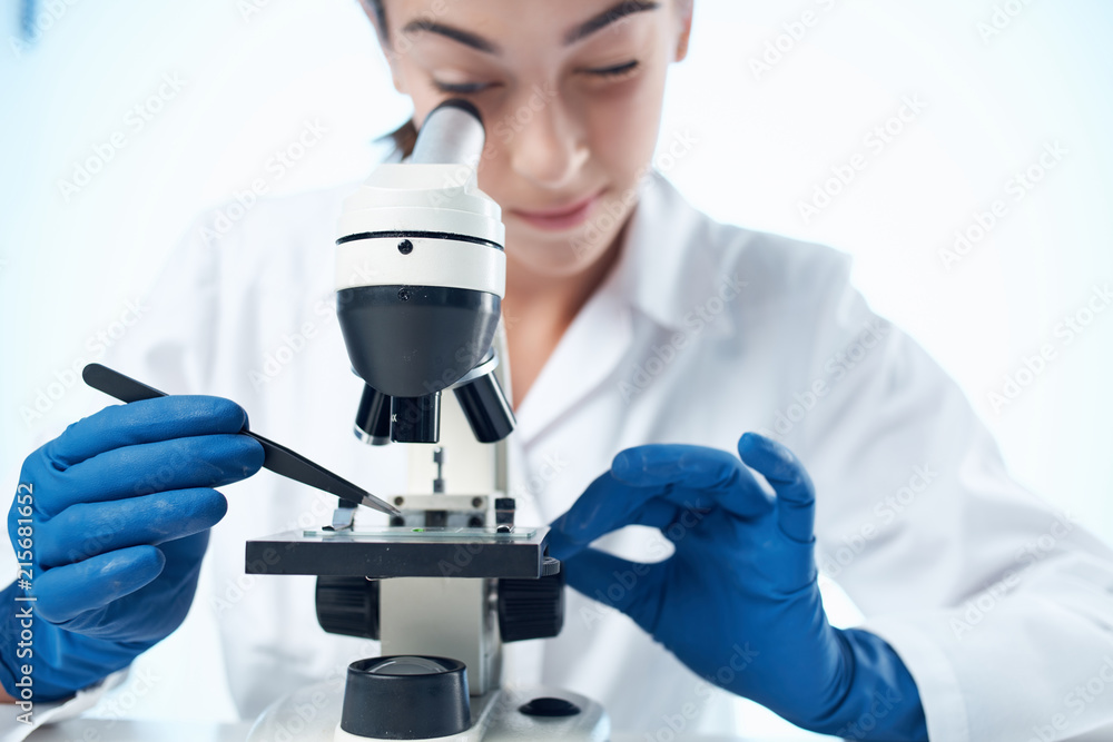 scientist looking through microscope scientist looking through microscope