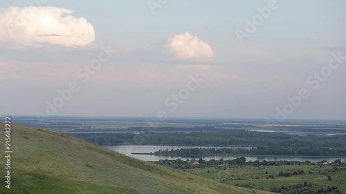 Panorama of a beautiful hill landscape, lake, river, forest, trees, and sky Russia. Life in the village