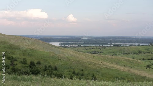 Panorama of a beautiful hill landscape, lake, river, forest, trees, and sky Russia. Life in the village
