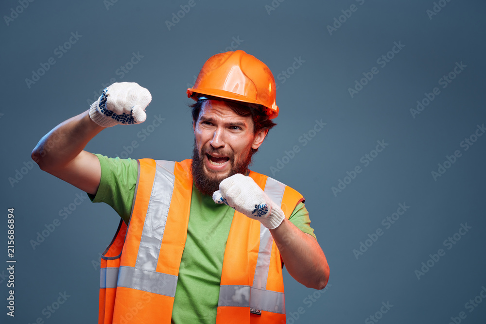 construction worker in a helmet working on a construction site construction worker in a helmet working on a construction site