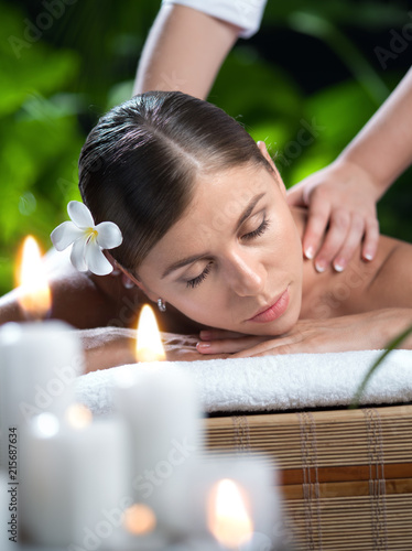 portrait of young beautiful woman in spa environment. 