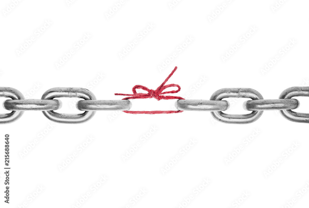 Obraz premium The weak link in the chain -Broken chain with piece of red string holding together, included clipping path