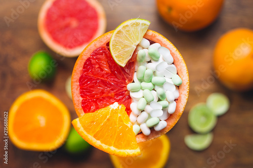 Fototapeta Naklejka Na Ścianę i Meble -  Vitamin C in citruses and supplement. Concept