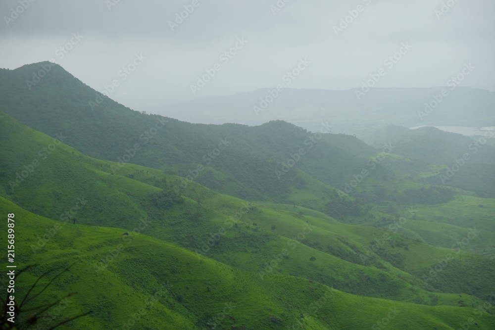 lush green landscape of mountain and hills in monsoon season, Purandar, Maharashtra, India