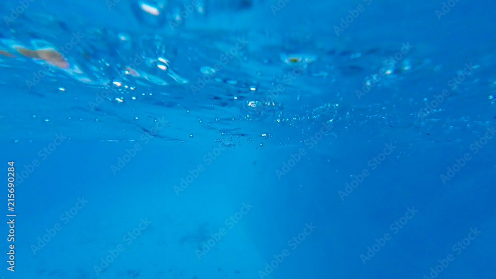 Photo under water from the pool water Park with bubbles Photo under water from the pool water Park with bubbles