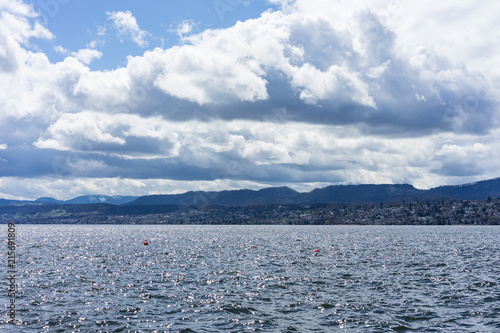 lake zurich with big clouds and vibrant water view