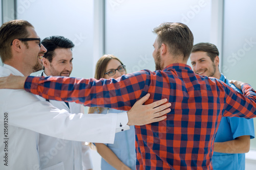 friendly male medical doctor greeting patient