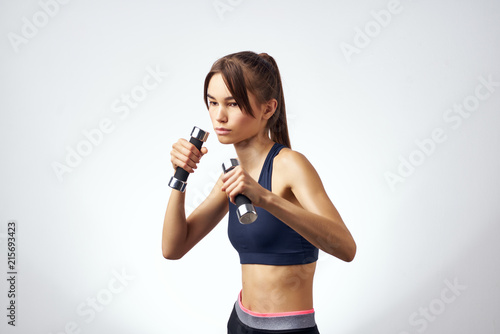 woman with sport dumbbells © SHOTPRIME STUDIO