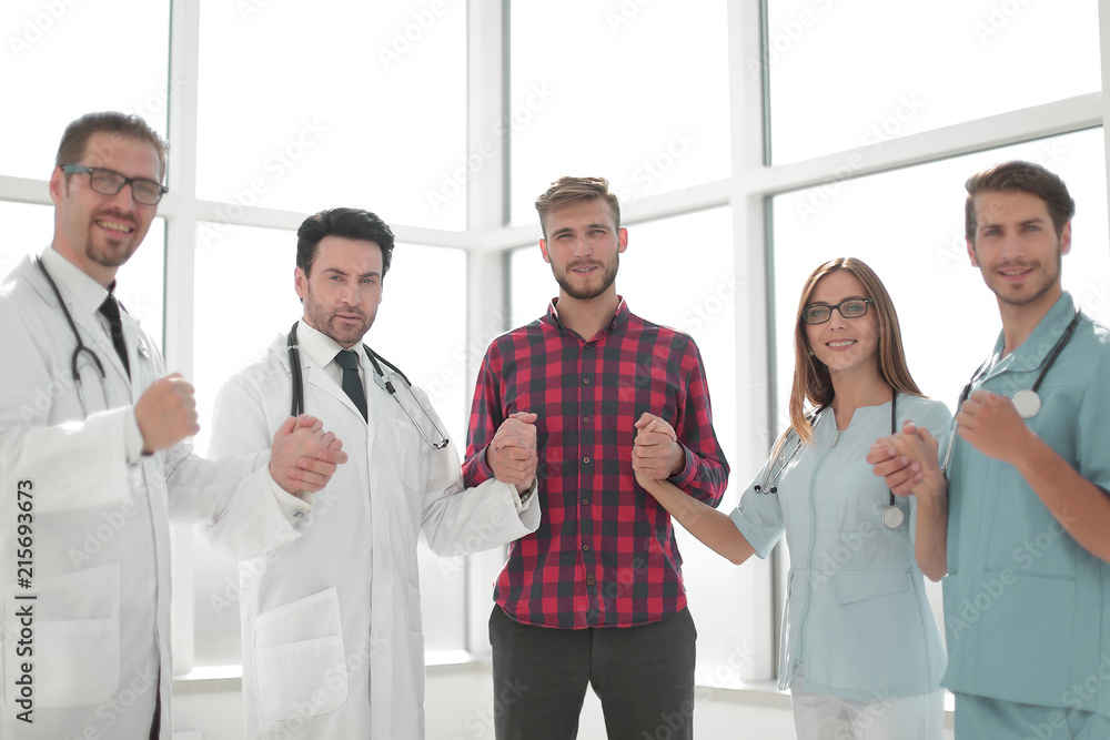 successful medical team with a patient successful medical team with a patient