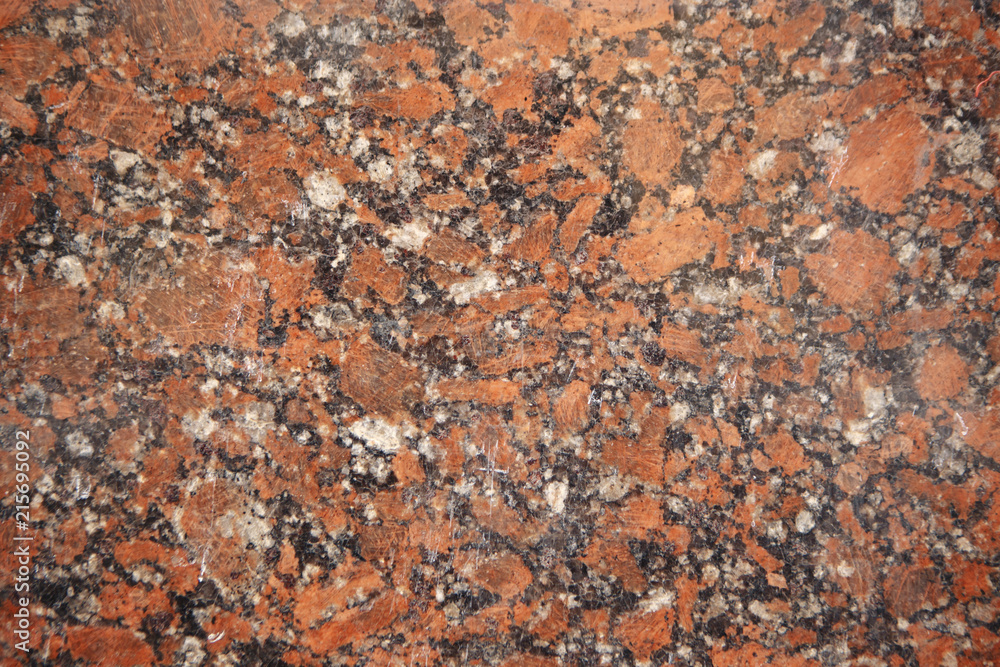 close up of a polished red marbled granite texture close up of a polished red marbled granite texture