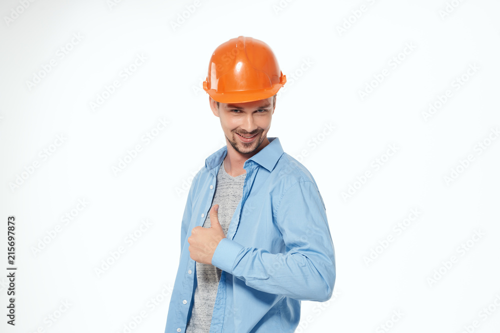 builder in helmet is smiling on an isolated background builder in helmet is smiling on an isolated background