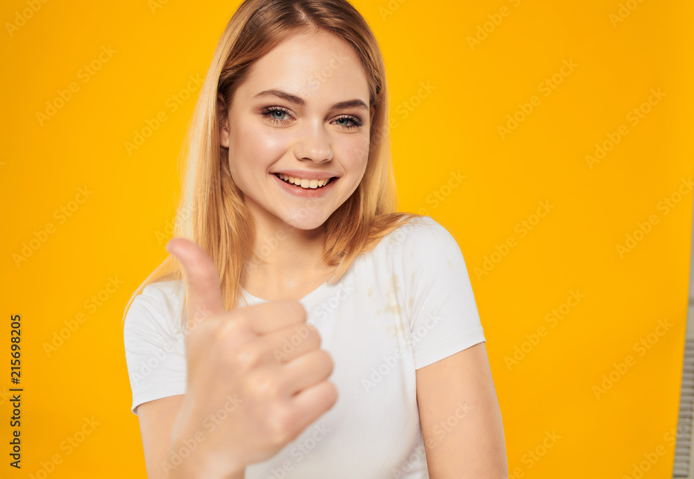 smiling woman showing thumbs up smiling woman showing thumbs up