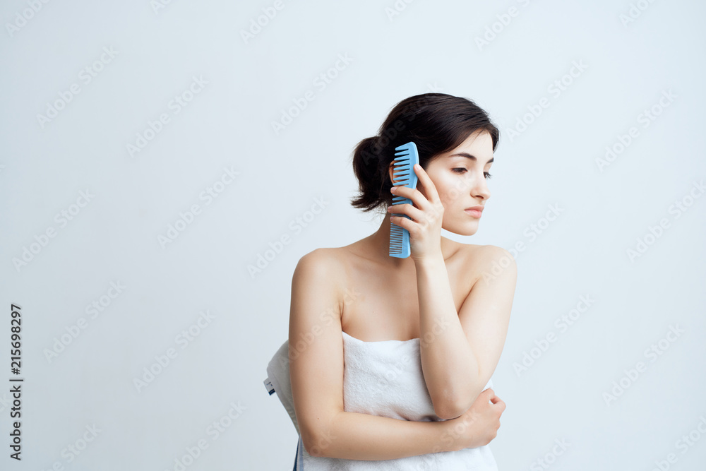 woman combing hair woman combing hair