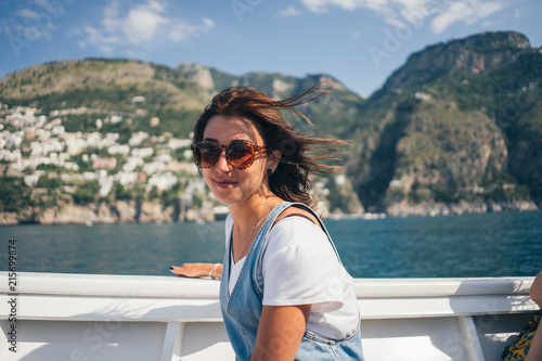 girl on a boat on a mountain background
