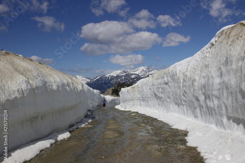 Summer snow walls in Whistler. Road through snow walls. Hiking in summer in British Columbia. photo