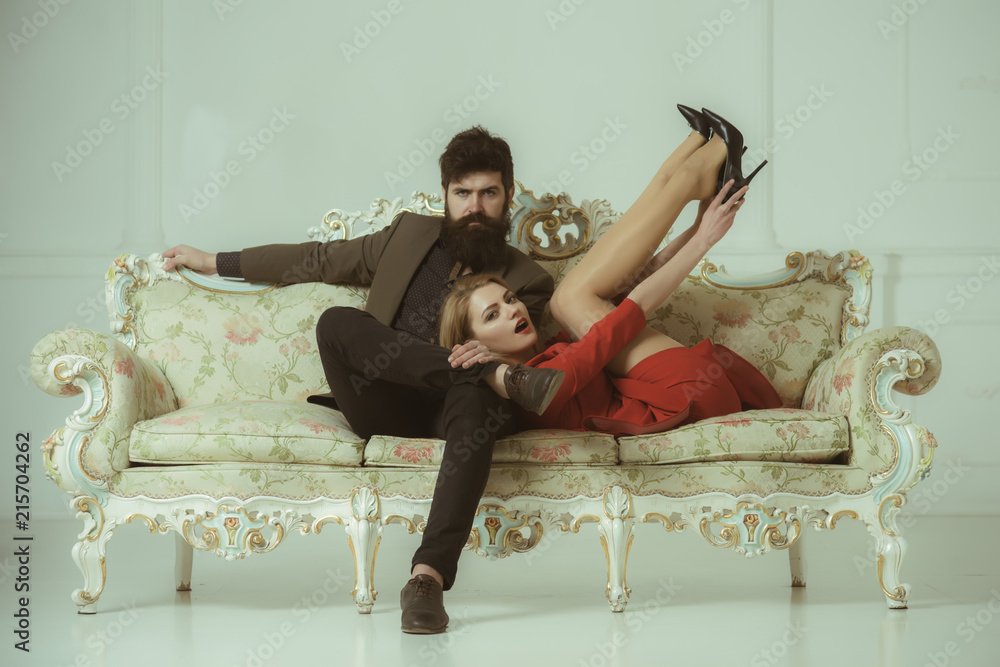 love and romance. couple in love relax on sofa. love relations of fashionable couple. stylish couple in love on luxury sofa. simple joy of loving love and romance. couple in love relax on sofa. love relations of fashionable couple. stylish couple in love on luxury sofa. simple joy of loving
