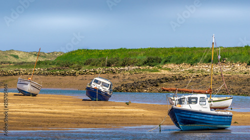 Photo Several boats on the beach at low tide, Burnham Overy Staithe, Norfolk