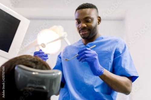 African female patient getting dental treatment in dental clinic