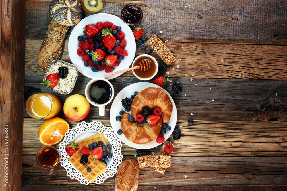 breakfast on table with waffles, croissants, coffe and juice. breakfast on table with waffles, croissants, coffe and juice.