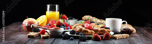 Fotografie, Tablou breakfast on table with waffles, croissants, coffe and juice.