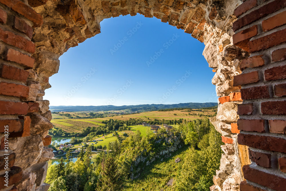 Picturesque rural landscape seen through the ruins of the castle in Czorsztyn. Poland