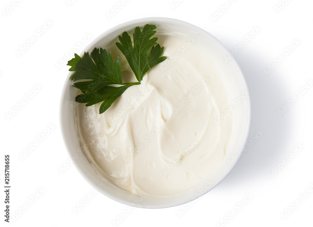 Cream cheese in a bowl, isolated on white background, top view. Cream cheese in a bowl, isolated on white background, top view.