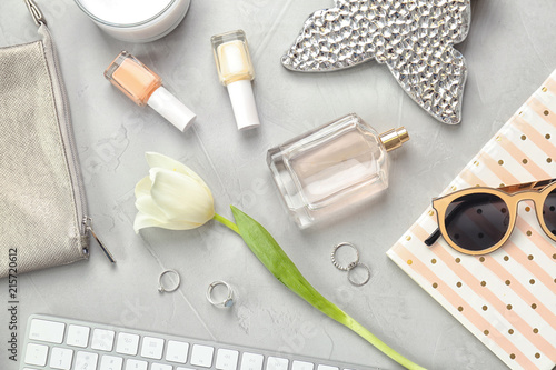 Flat lay composition with cosmetics and stylish accessories on light background