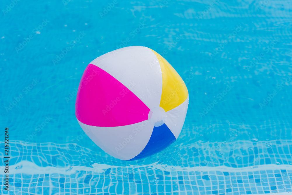 Colorful ball on water close up