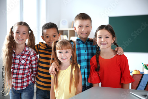 Cute little children in classroom. Elementary school