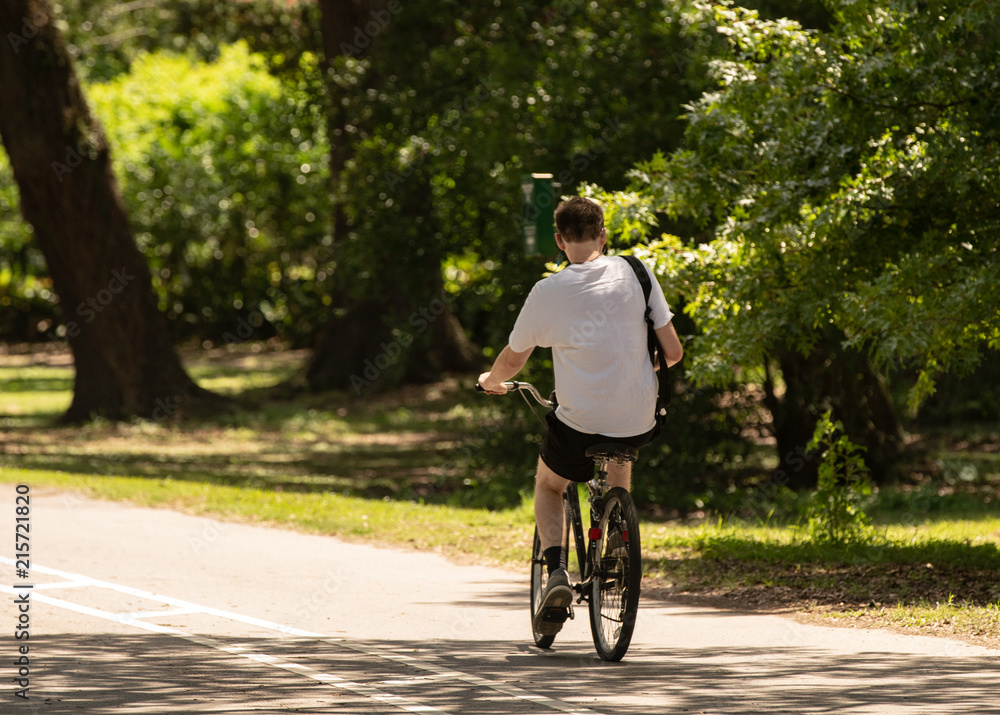 unknown student rides bike home from school