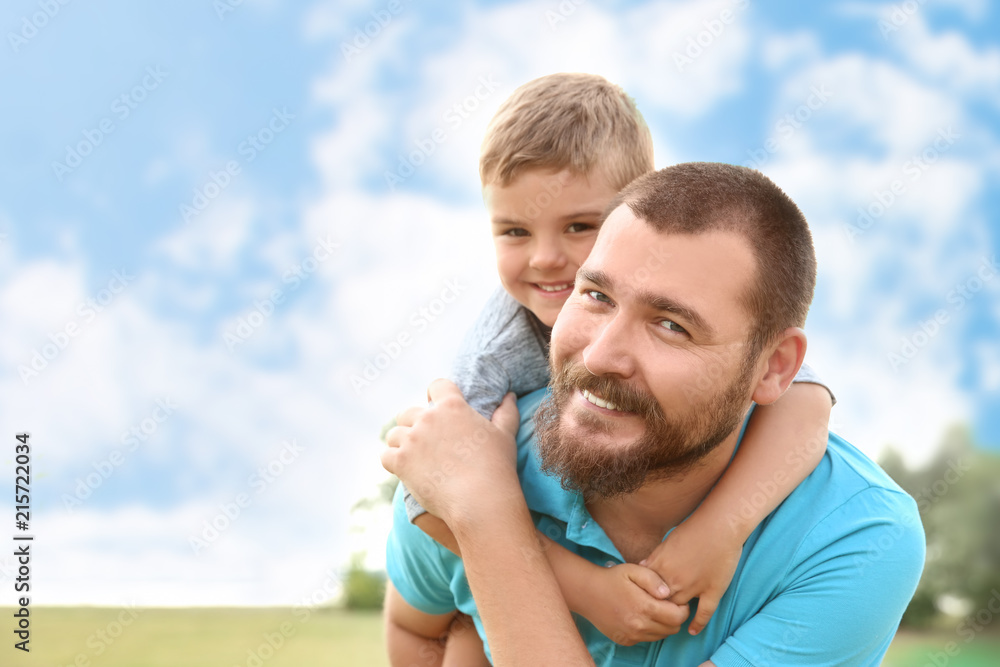 Fototapeta premium Man with his child outdoors. Happy family