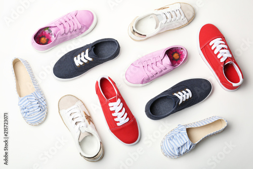 Flat lay composition with stylish new shoes on white background