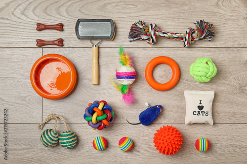 Fototapeta Naklejka Na Ścianę i Meble -  Flat lay composition with accessories for dog and cat on wooden background. Pet care