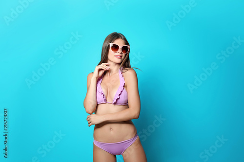 Sexy young woman in bikini on color background © New Africa