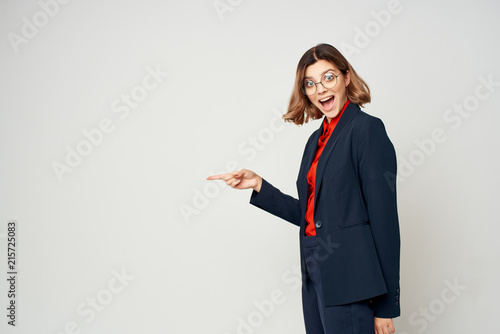 joyful business woman shows finger to the place free