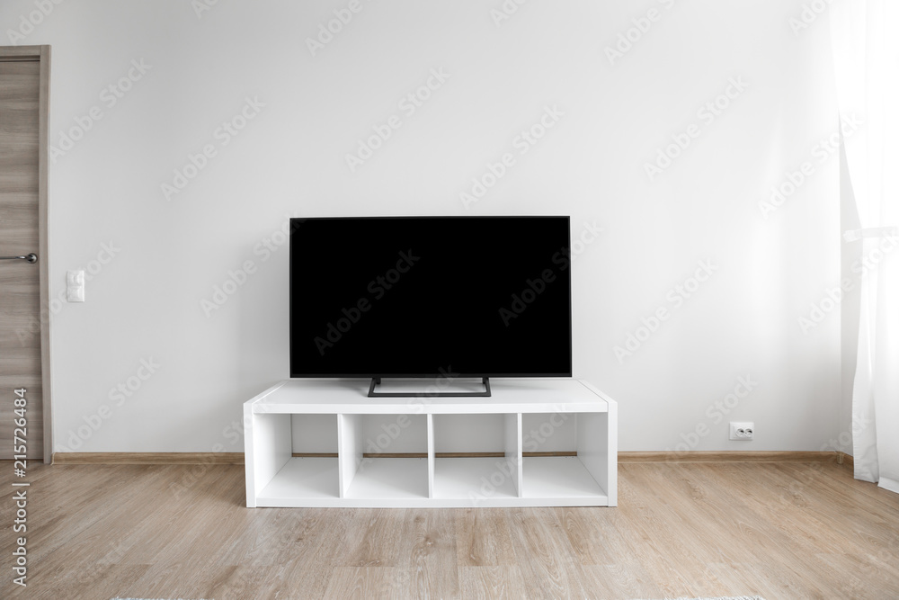 Lcd tv on white shef at modern room interior Lcd tv on white shef at modern room interior